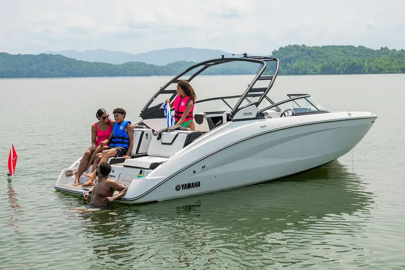 Slide: The Image of Manufacturer Provided Image: 2026 Yamaha Boats 252S on a lake with people enjoying leisure time. - 2