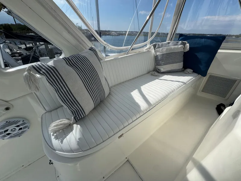 Slide: The Image of Interior of 1995 Ocean Yachts 42 SS with striped cushions. - 14