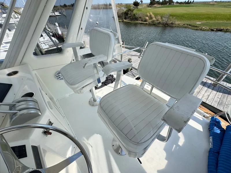 Slide: The Image of Interior of a 1995 Ocean Yachts 42 SS with white seating. - 18