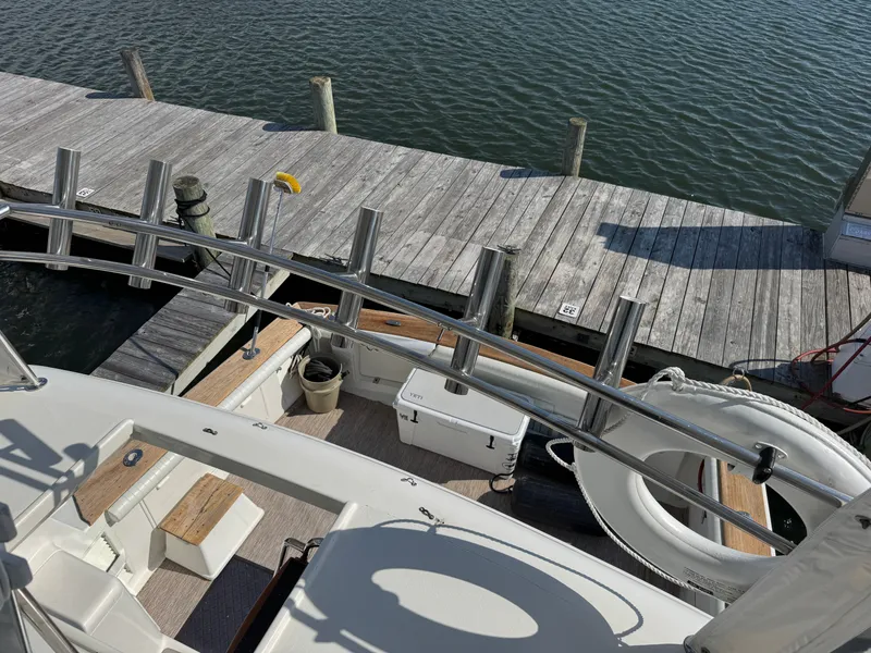 Slide: The Image of 1995 Ocean Yachts 42 SS docked with lifebuoy visible. - 19