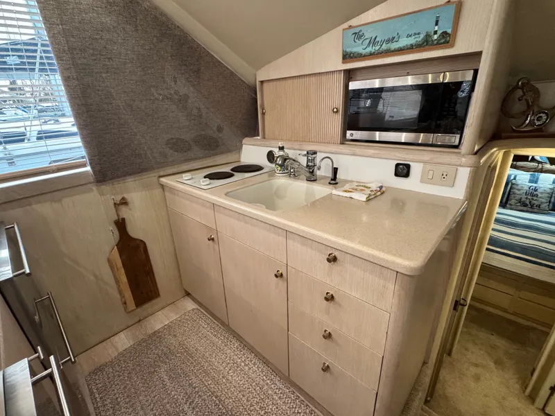Slide: The Image of Compact kitchen in a 1995 Ocean Yachts 42 SS. - 24