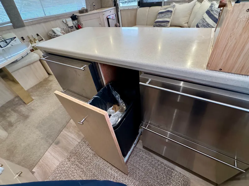 Slide: The Image of Interior of 1995 Ocean Yachts 42 SS with open cabinet door. - 25