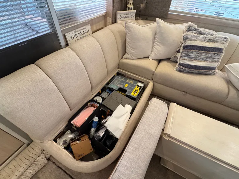 Slide: The Image of Interior of Ocean Yachts 42 SS with storage under the sofa. - 26