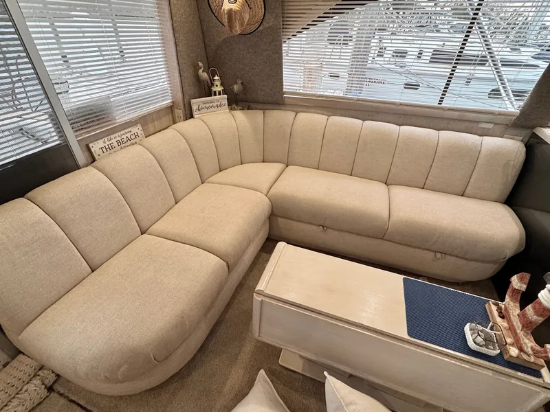 Slide: The Image of Interior of a 1995 Ocean Yachts 42 SS with beige sofa. - 27