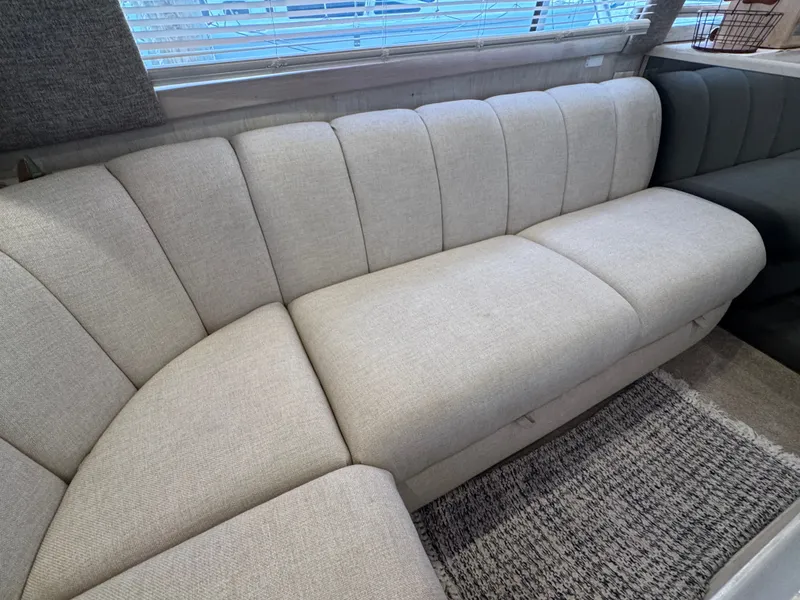 Slide: The Image of Interior of 1995 Ocean Yachts 42 SS featuring beige sofa. - 28