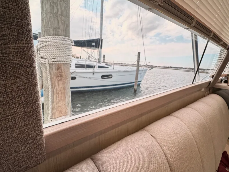 Slide: The Image of Interior view of a 1995 Ocean Yachts 42 SS overlooking the water. - 30