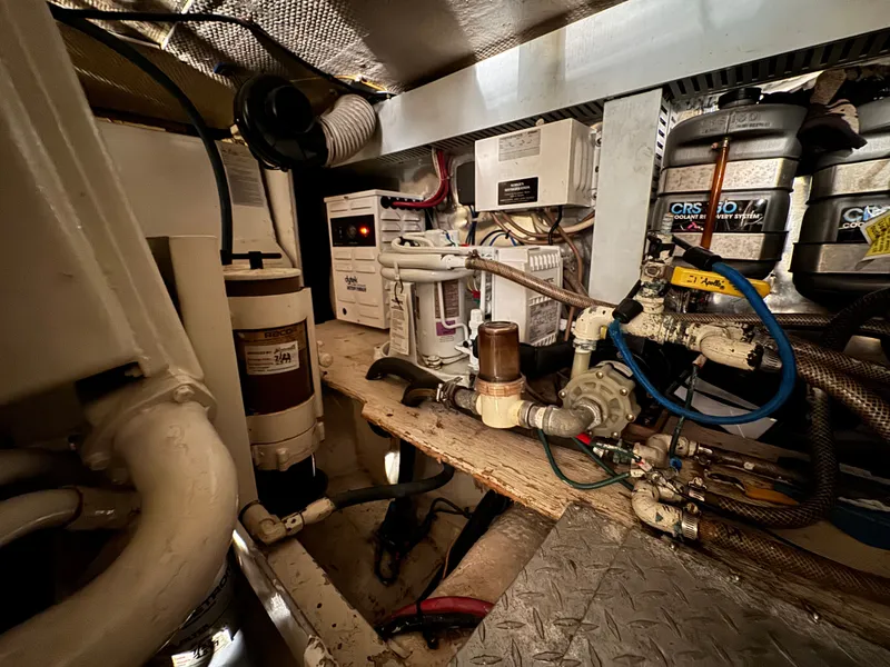 Slide: The Image of Engine room of 1995 Ocean Yachts 42 SS with technical components. - 39