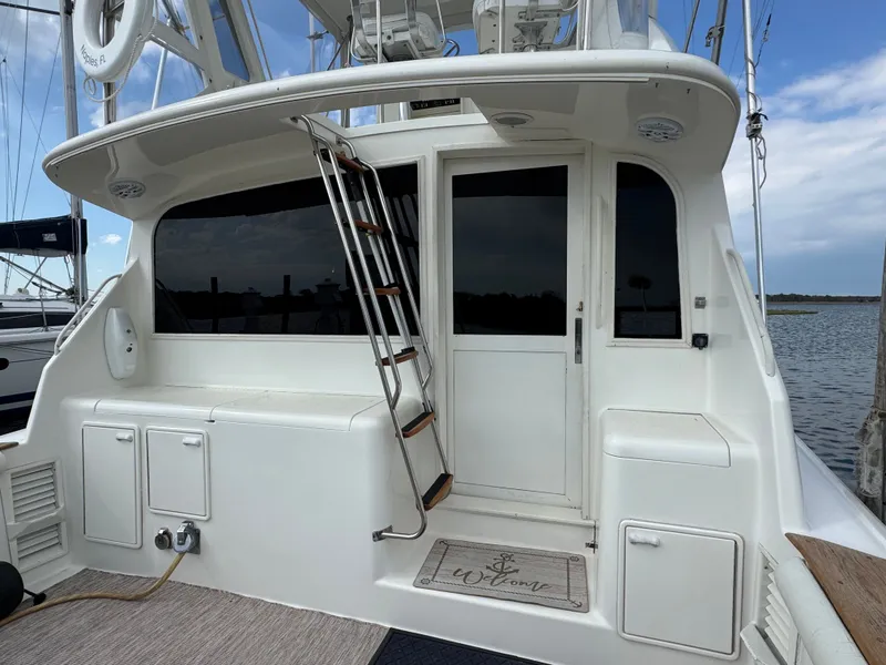 Slide: The Image of Ocean Yachts 42 SS 1995, stern view with ladder and welcome mat. - 4