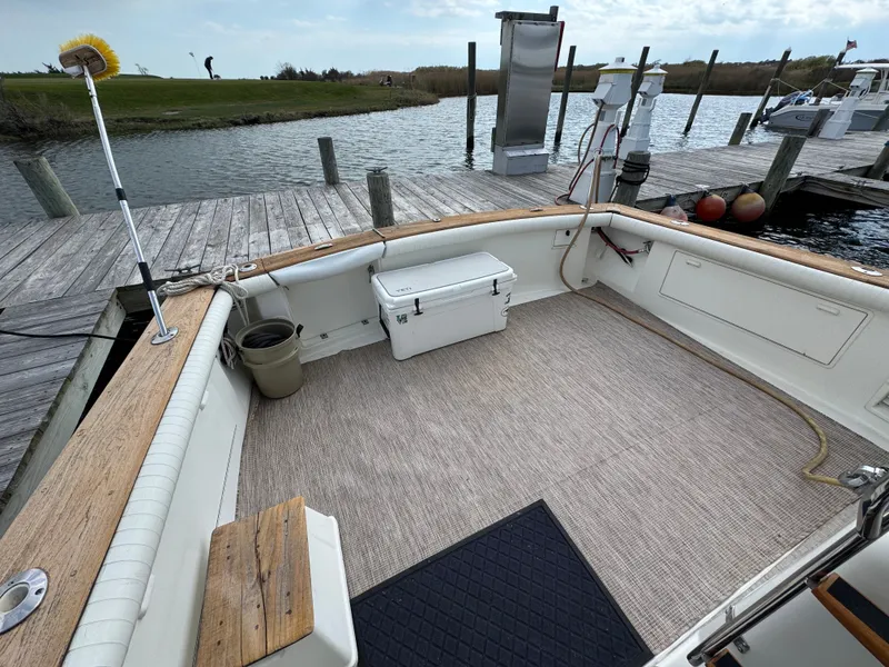 Slide: The Image of Deck of a 1995 Ocean Yachts 42 SS with cooler and fishing gear. - 5