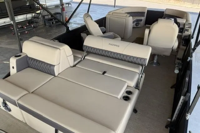 Slide: The Image of 2025 Harris Sunliner 230 pontoon boat interior with luxurious seating and modern design. - 5