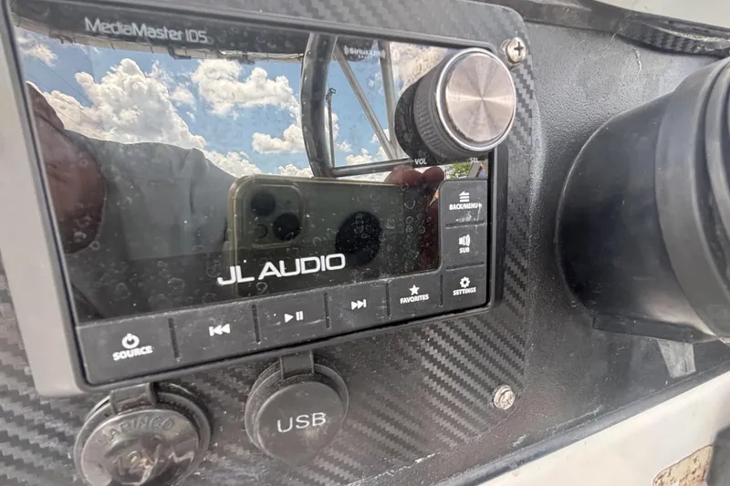 Slide: The Image of JL Audio MediaMaster 105 on 1994 Trophy 1802 Walkaround boat dashboard, featuring USB port. - 15