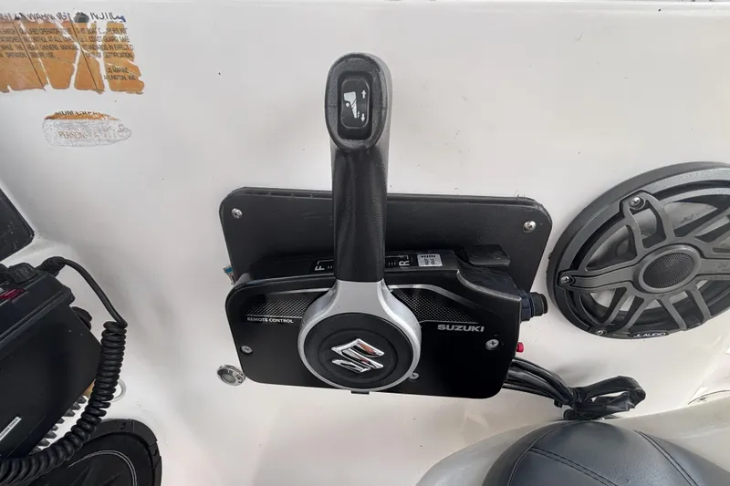 Slide: The Image of Suzuki remote control on 1994 Trophy 1802 Walkaround boat, featuring JL Audio speaker. - 16