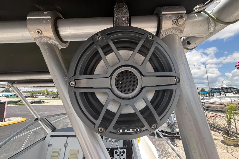 Slide: The Image of JL Audio speaker mounted on a 1994 Trophy 1802 Walkaround boat, with a clear sky background. - 18