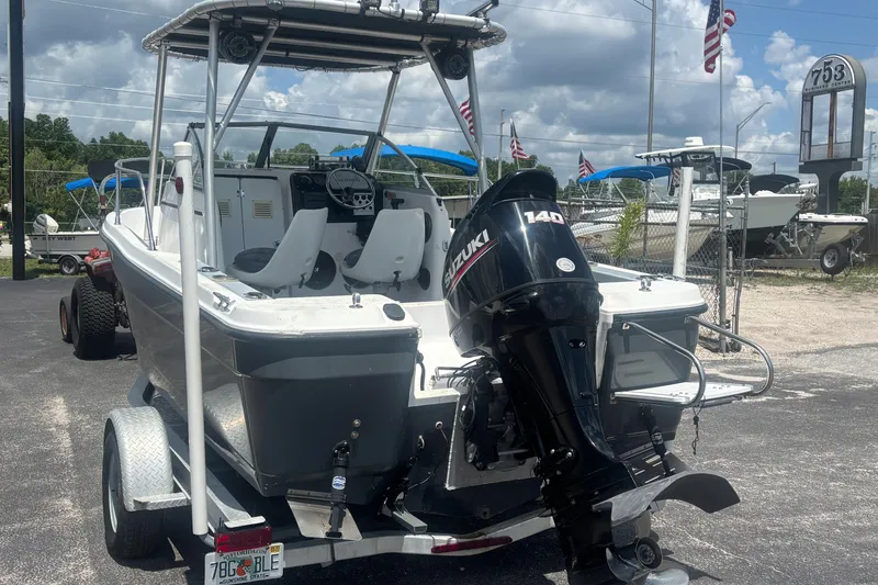 Slide: The Image of 1994 Trophy 1802 Walkaround boat with Suzuki 140 outboard motor on trailer. - 3
