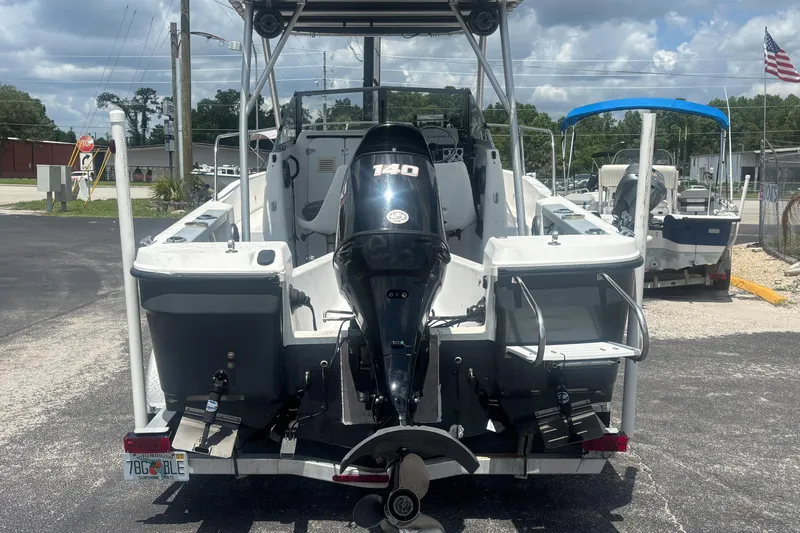 Slide: The Image of 1994 Trophy 1802 Walkaround boat with 140 HP engine, parked outdoors. - 4