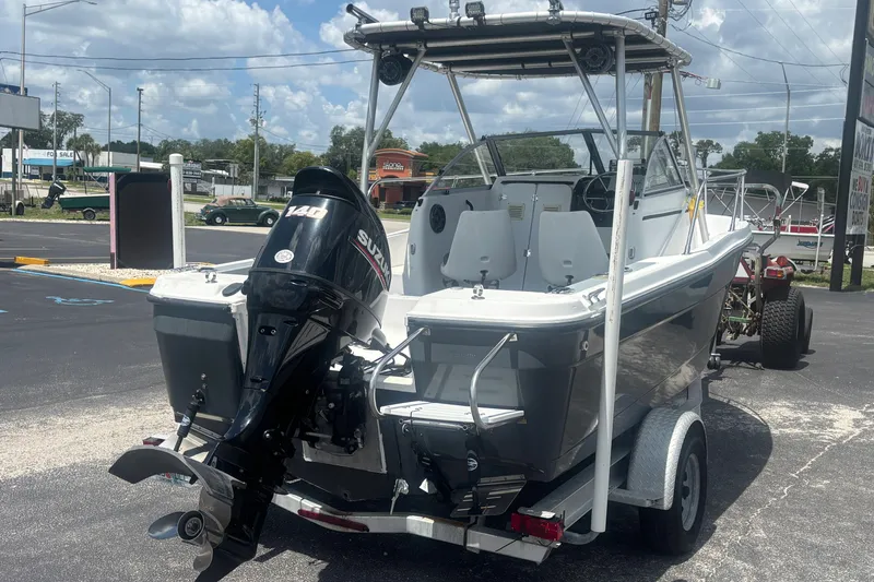 Slide: The Image of 1994 Trophy 1802 Walkaround boat with Suzuki 140 outboard motor on trailer. - 5