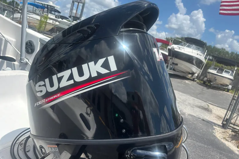 Slide: The Image of Suzuki four-stroke outboard motor on a 1994 Trophy 1802 Walkaround boat. - 9