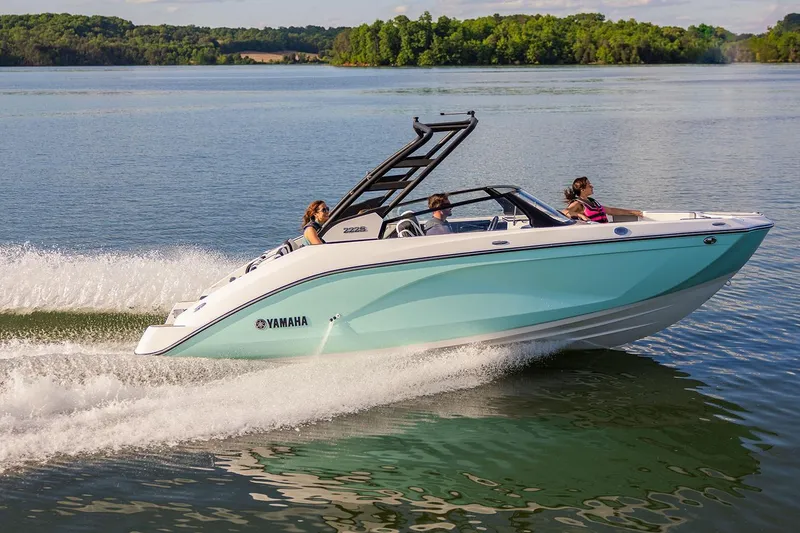 Slide: The Image of Manufacturer Provided Image: 2026 Yamaha Boats 222S cruising on a serene lake with passengers enjoying the ride. - 1