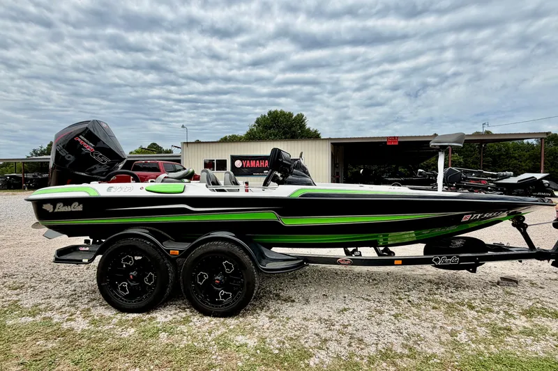 The Image of 2023 BassCat Erya boat with Yamaha engine, parked outdoors under cloudy sky. - 0