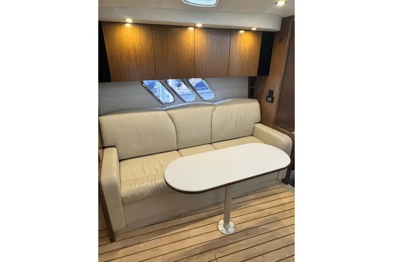 Slide: The Image of Luxurious interior of 2015 Cruisers Yachts 380 Express with beige sofa and wooden accents. - 10