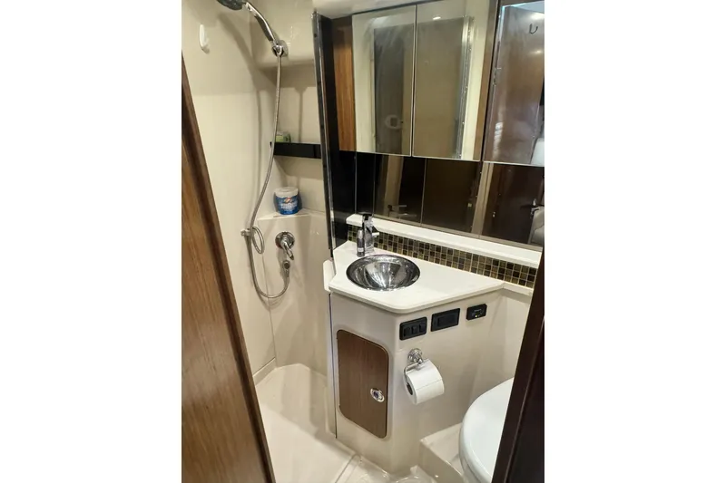 Slide: The Image of Bathroom interior of 2015 Cruisers Yachts 380 Express with shower and sink. - 12