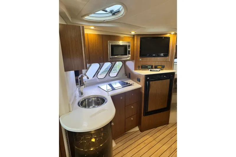 Slide: The Image of Luxurious 2015 Cruisers Yachts 380 Express interior with modern kitchen amenities. - 9