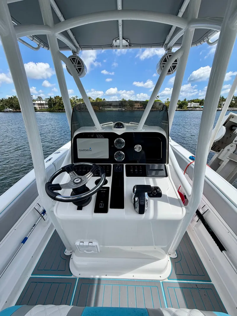 Slide: The Image of Interior view of a 2019 Concept 27 boat with helm console. - 9