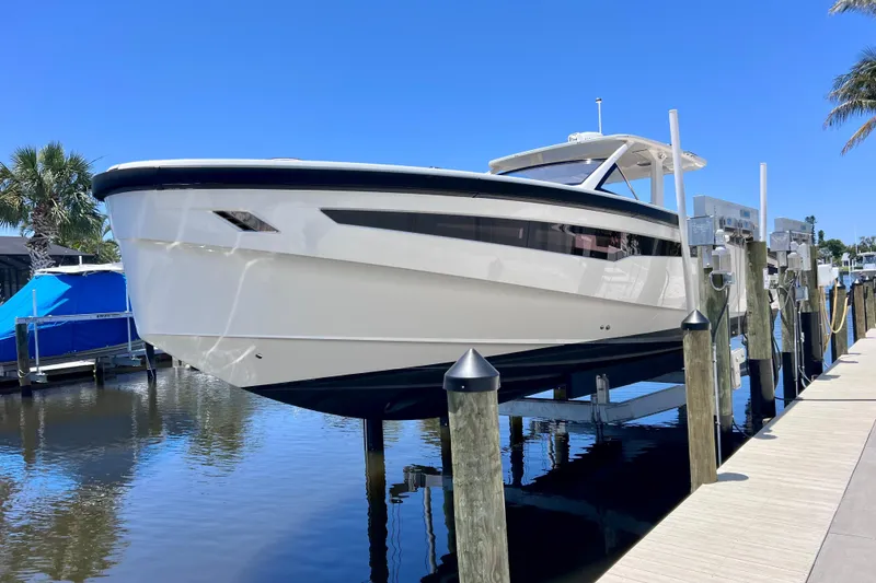 Slide: The Image of 2022 Windy SR 44 BLACKHAWK yacht docked, showcasing sleek design and modern features. - 10