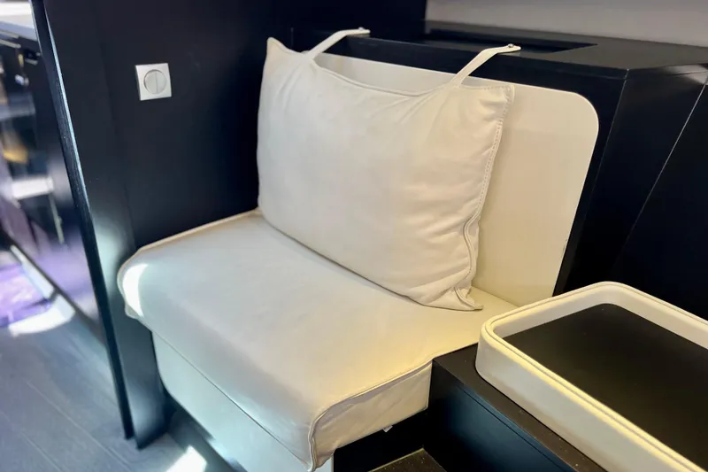 Slide: The Image of Luxurious seating area on 2022 Windy SR 44 BLACKHAWK yacht, featuring elegant white upholstery. - 100
