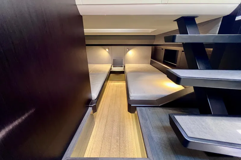 Slide: The Image of Luxurious interior of 2022 Windy SR 44 BLACKHAWK yacht with modern twin beds and sleek design. - 102