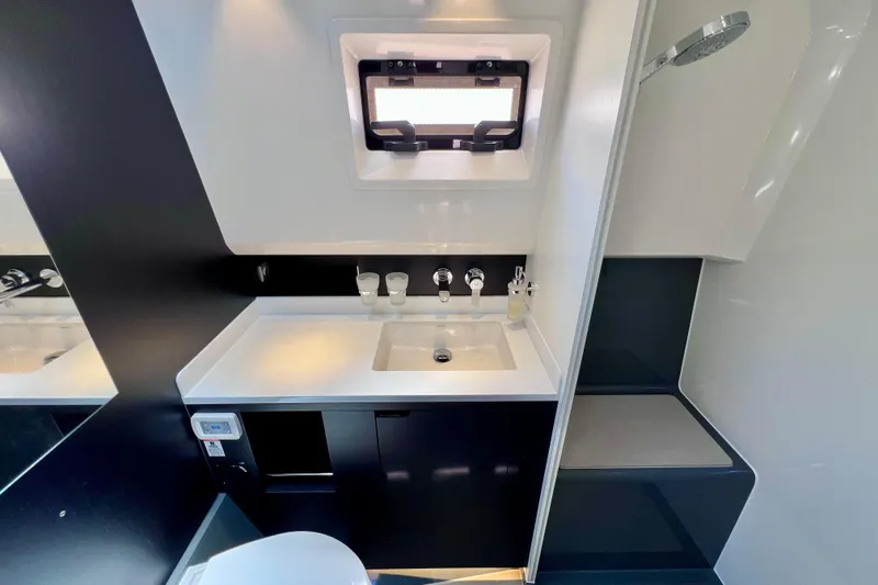 Slide: The Image of Luxurious bathroom interior of 2022 Windy SR 44 BLACKHAWK yacht with modern fixtures. - 108
