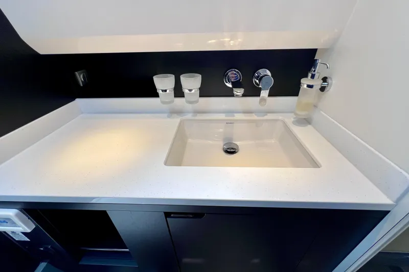 Slide: The Image of Modern bathroom sink in 2022 Windy SR 44 BLACKHAWK yacht, featuring sleek design and fixtures. - 111