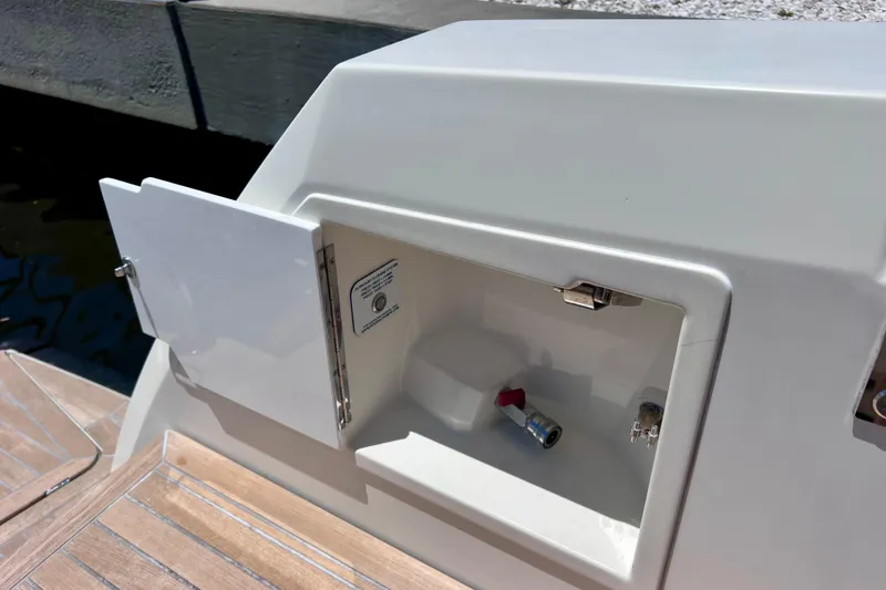 Slide: The Image of Open storage compartment on 2022 Windy SR 44 BLACKHAWK boat, featuring a sleek design. - 113