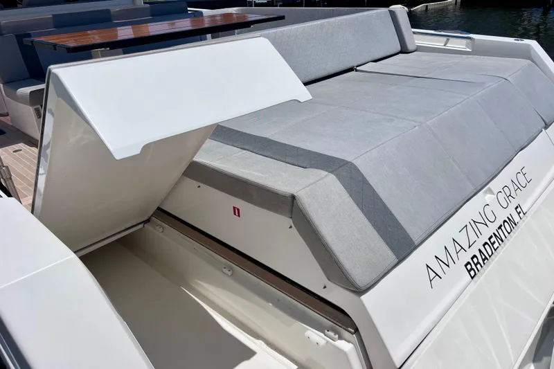 Slide: The Image of 2022 Windy SR 44 BLACKHAWK yacht with open storage compartment and cushioned seating. - 115
