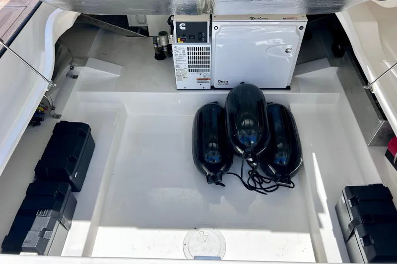 Slide: The Image of Storage compartment of 2022 Windy SR 44 BLACKHAWK with generator and fenders. - 119