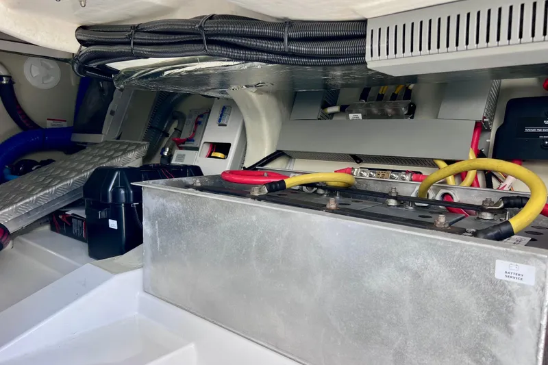 Slide: The Image of Engine compartment of 2022 Windy SR 44 BLACKHAWK with battery and wiring components. - 122