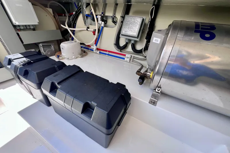 Slide: The Image of Engine room of 2022 Windy SR 44 BLACKHAWK with equipment and storage boxes. - 124