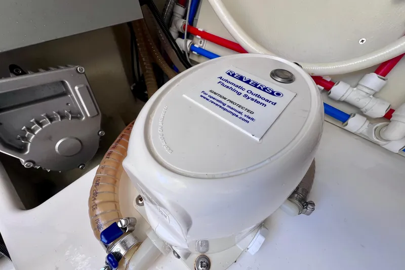 Slide: The Image of Reverso automatic outboard flushing system in 2022 Windy SR 44 Blackhawk boat. - 125