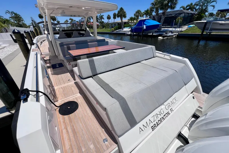 Slide: The Image of Luxury 2022 Windy SR 44 BLACKHAWK yacht docked, featuring spacious seating and elegant design. - 18
