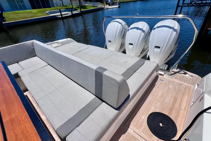 Slide: The Image of 2022 Windy SR 44 BLACKHAWK boat with triple Yamaha engines and spacious seating area. - 20
