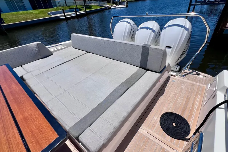 Slide: The Image of 2022 Windy SR 44 BLACKHAWK yacht with spacious sunbed and triple outboard engines. - 21