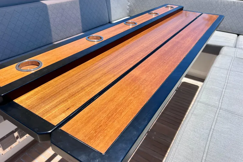 Slide: The Image of Luxury wooden table with cup holders on 2022 Windy SR 44 BLACKHAWK yacht. - 24