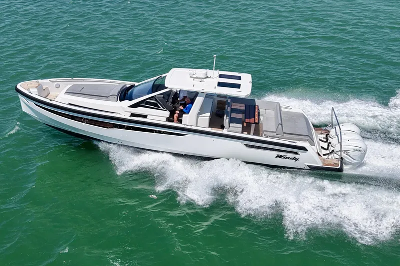 Slide: The Image of 2022 Windy SR 44 BLACKHAWK cruising on turquoise waters, showcasing sleek design and powerful engines. - 3