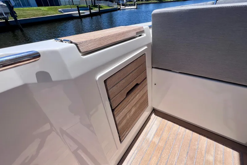 Slide: The Image of Interior view of 2022 Windy SR 44 BLACKHAWK boat with wooden accents and seating. - 34