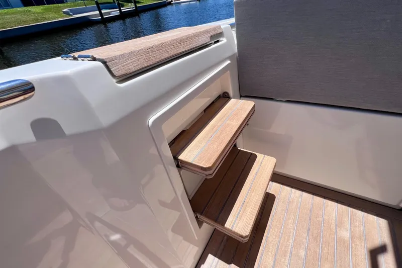 Slide: The Image of Steps on a 2022 Windy SR 44 BLACKHAWK yacht, featuring wooden accents and sleek design. - 35