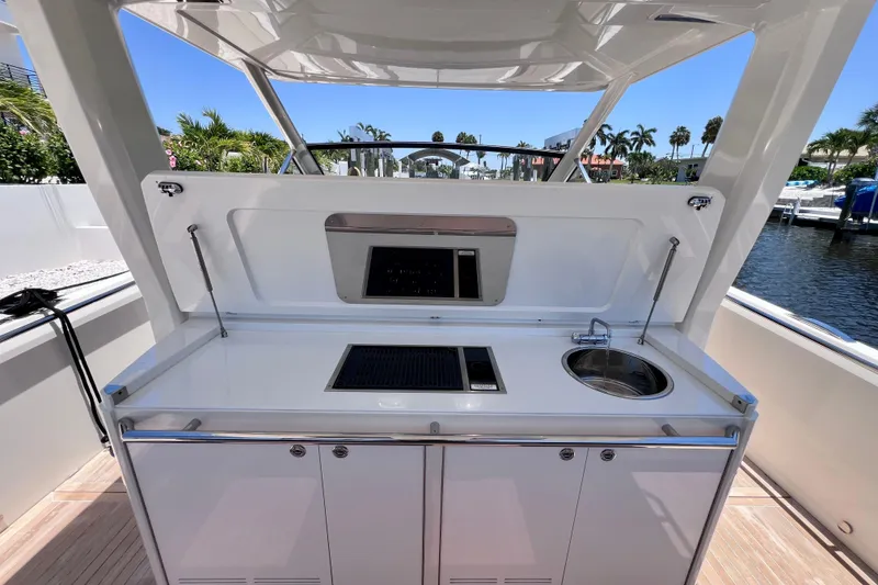 Slide: The Image of Outdoor kitchenette on 2022 Windy SR 44 BLACKHAWK yacht, featuring sink and grill. - 38