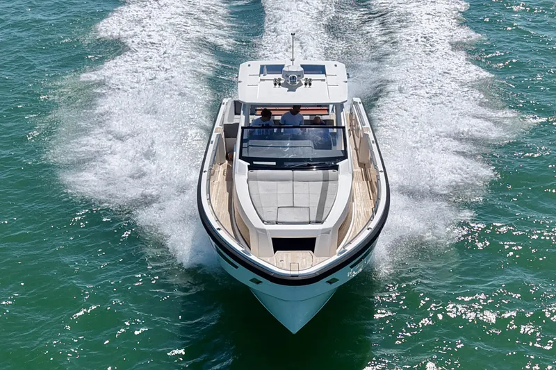 Slide: The Image of 2022 Windy SR 44 BLACKHAWK cruising on clear blue water, aerial view. - 4