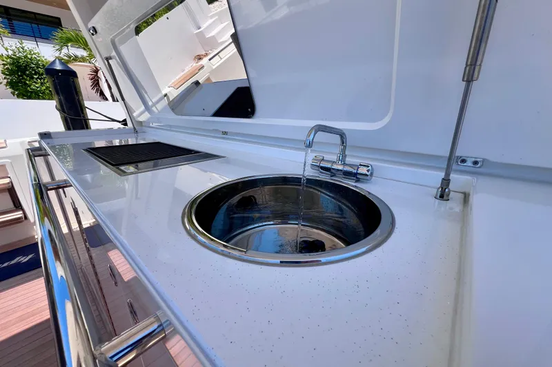 Slide: The Image of Outdoor sink and faucet on 2022 Windy SR 44 BLACKHAWK yacht deck. - 40