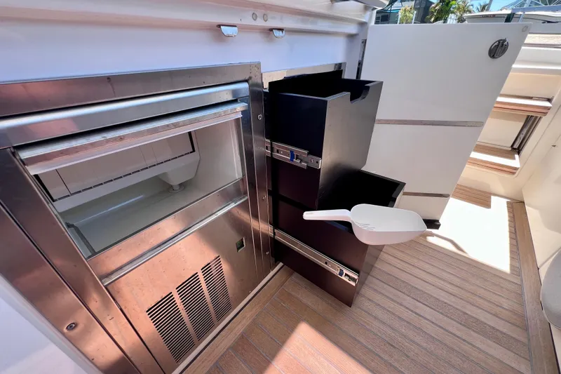 Slide: The Image of Modern kitchen area on 2022 Windy SR 44 BLACKHAWK yacht with stainless steel appliances. - 42