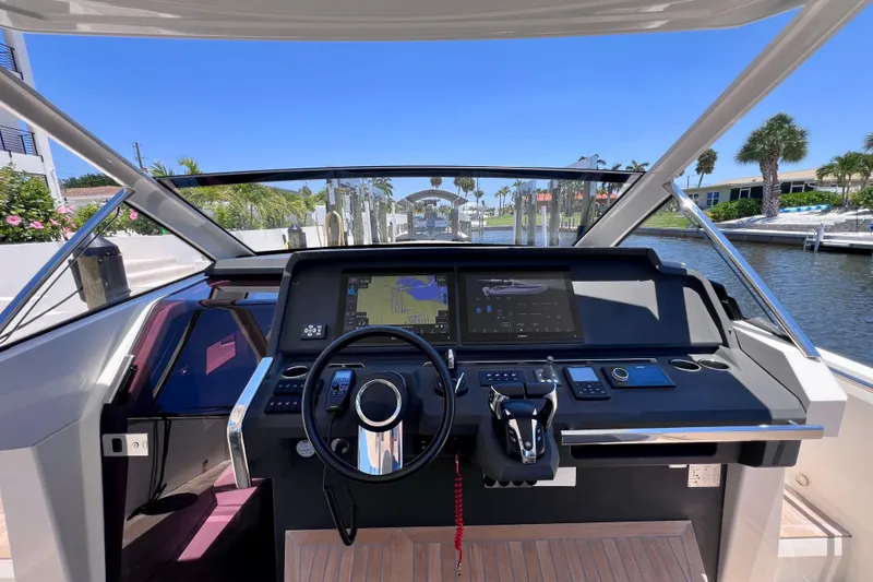 Slide: The Image of Helm of 2022 Windy SR 44 BLACKHAWK yacht with advanced navigation system and controls. - 44